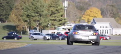 Image of a car rotating through a race track corner