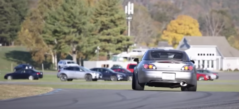 Image of a car rotating through a race track corner