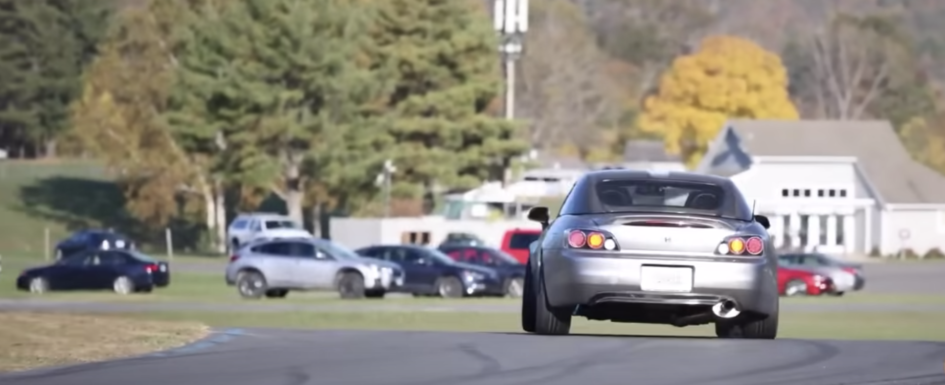 Image of a car rotating through a race track corner